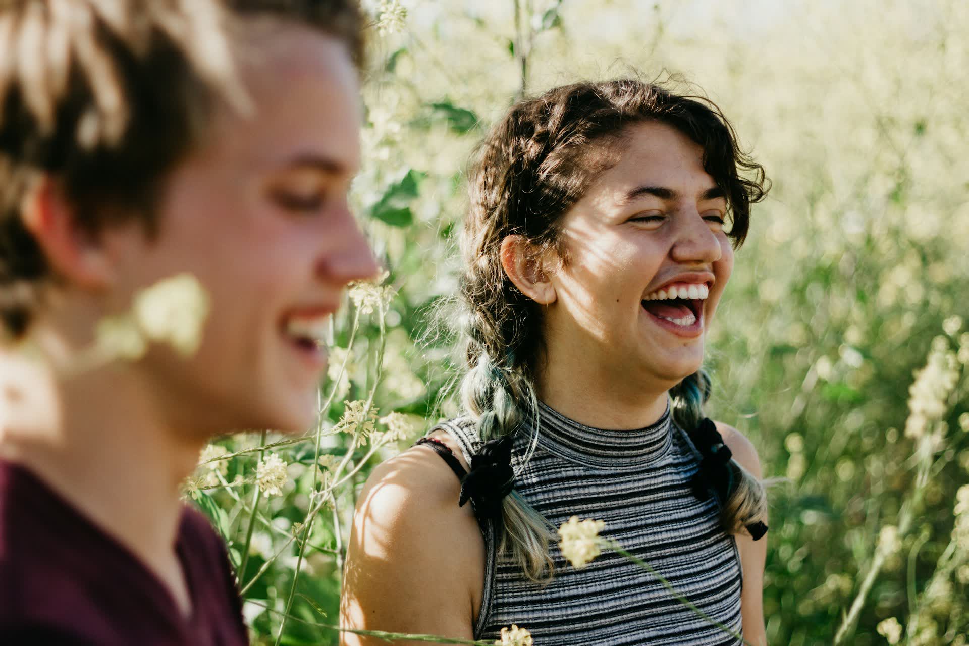 Man and woman laughing together outdoors