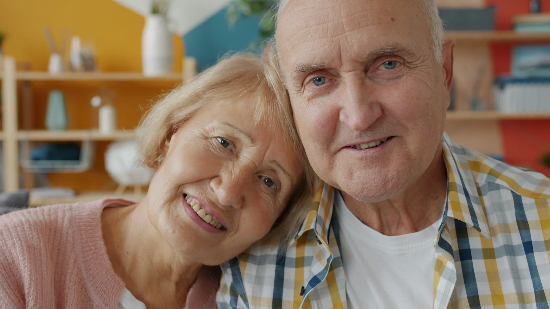 Smiling older couple at home