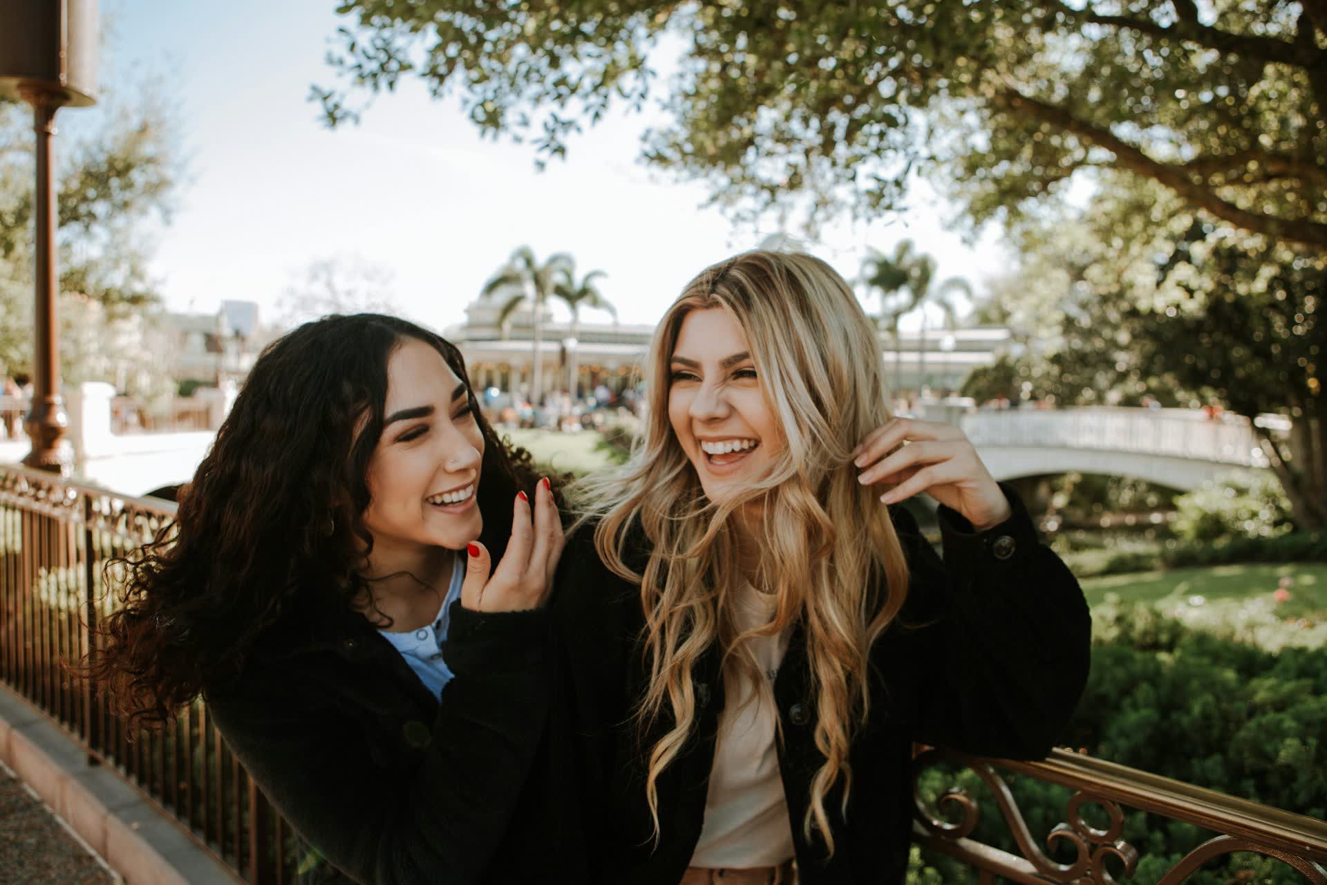 Two friends smiling outdoors