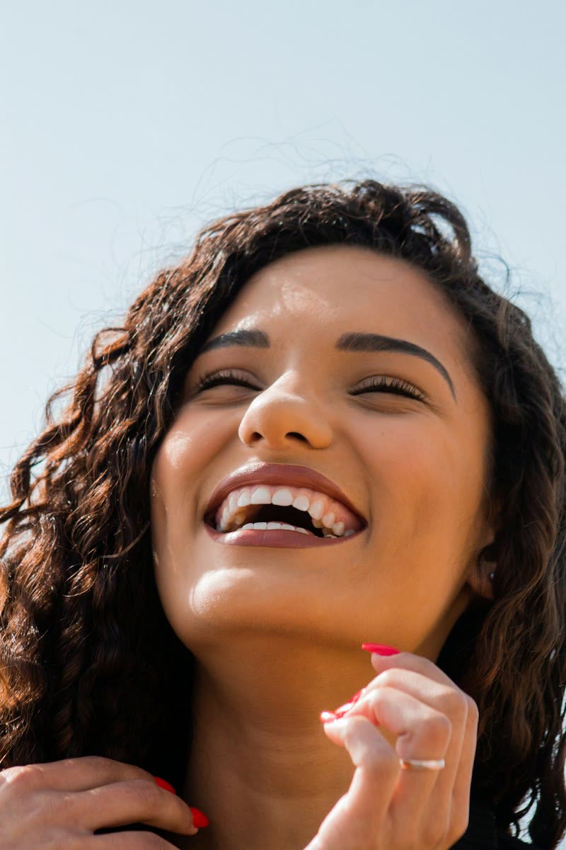 Smiling woman with curly hair
