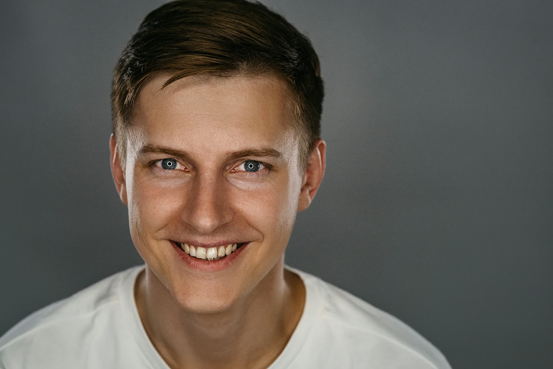 Smiling man in a white shirt