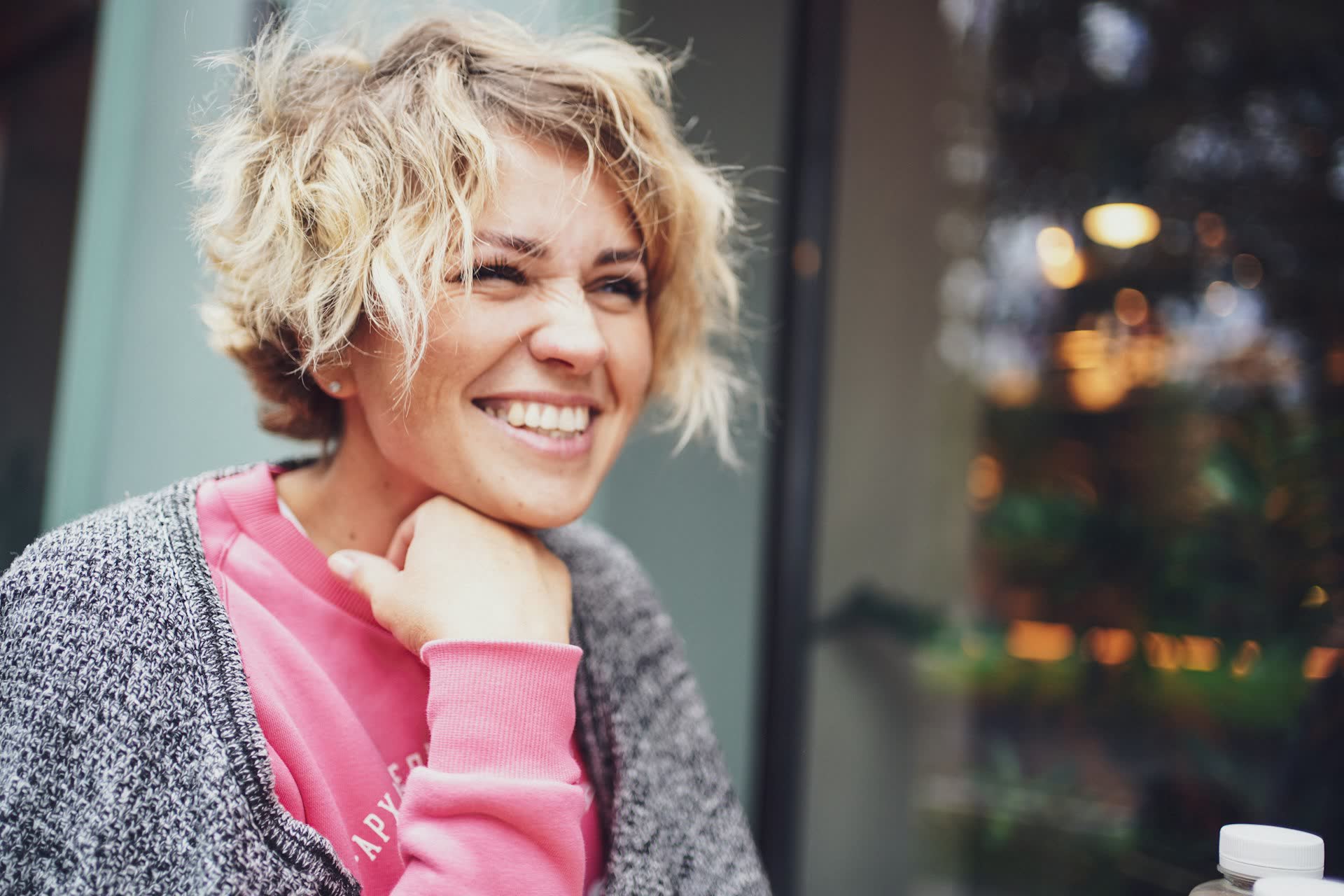 Smiling woman in a pink shirt